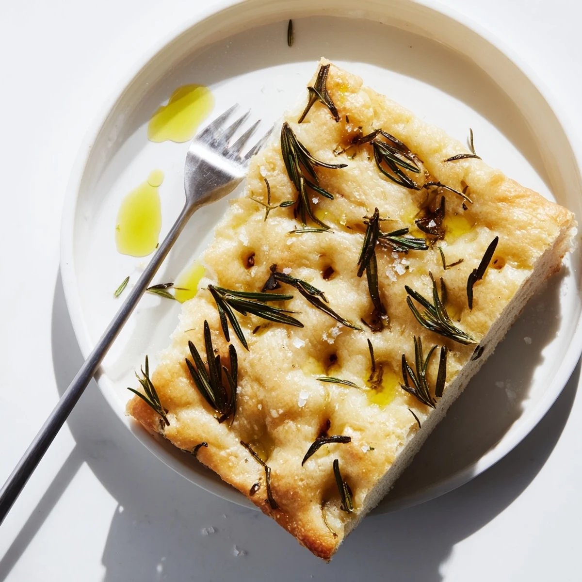 Aromatically baked Holiday Bread, with a crispy crust and fragrant rosemary, ready for the table.
