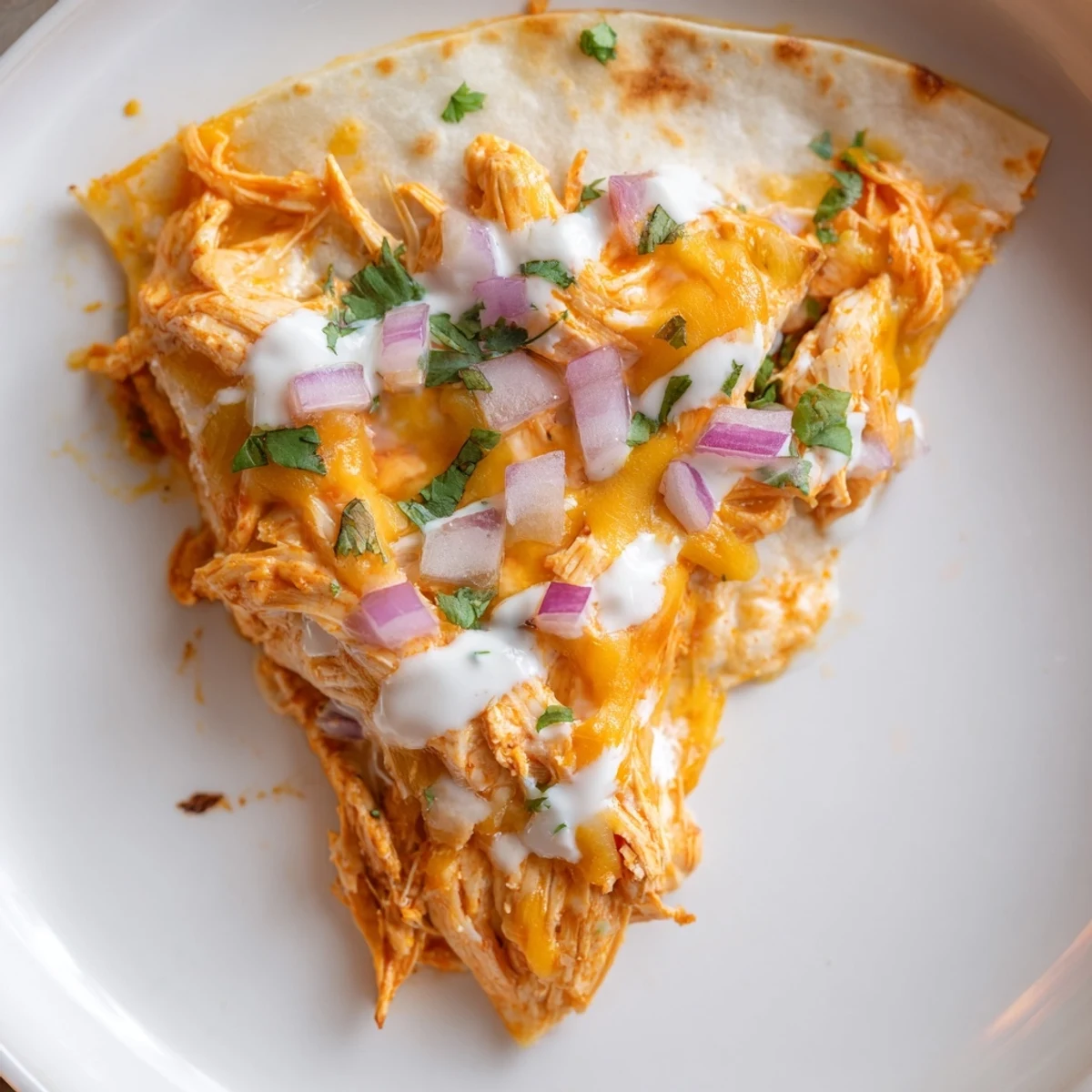 Golden-brown Buffalo Chicken Quesadilla, oozing melted cheese, a spicy and savory treat ready to enjoy.