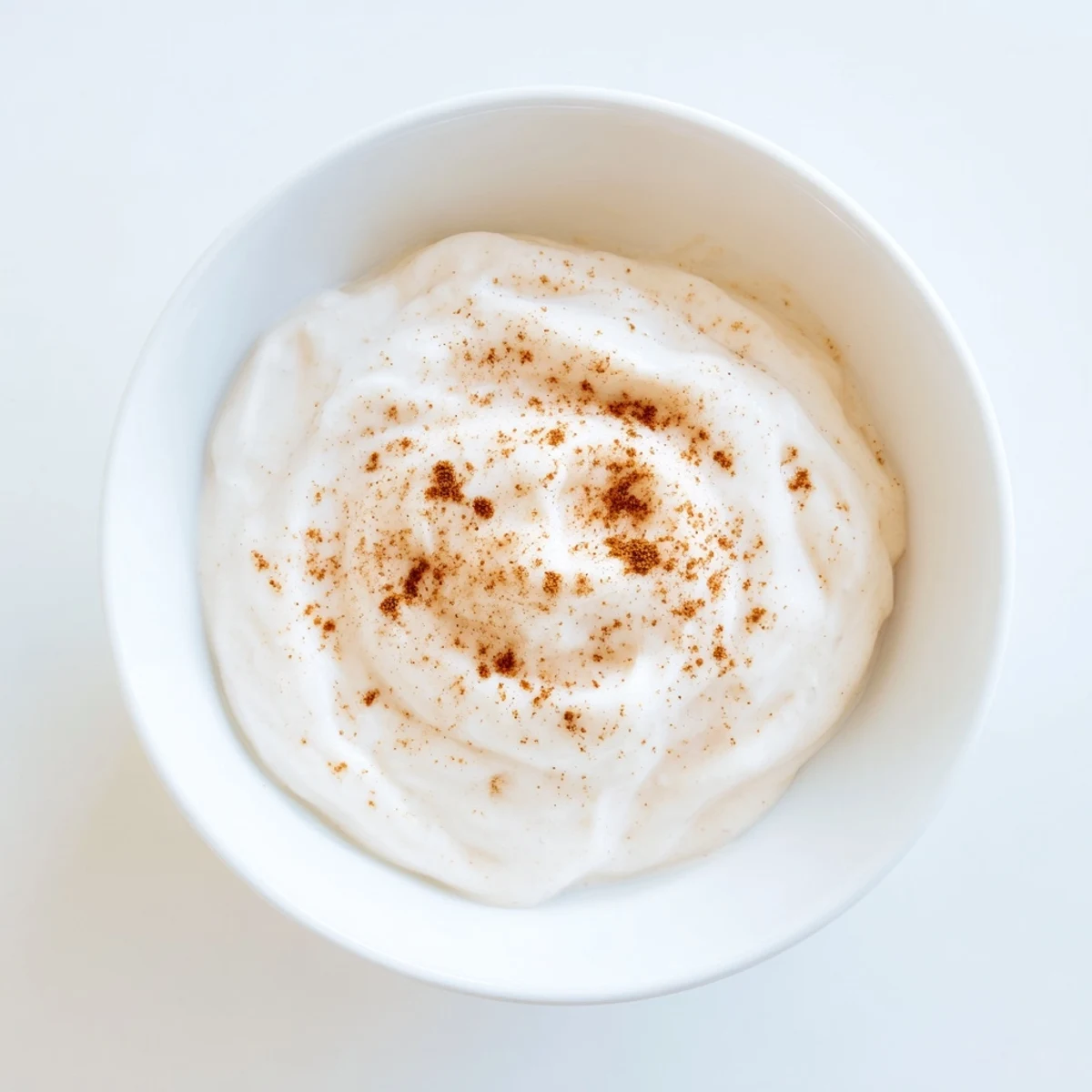 Thick and sweet Greek Yogurt Fruit Dip, perfect for dipping berries, ready to enjoy at a summer gathering.