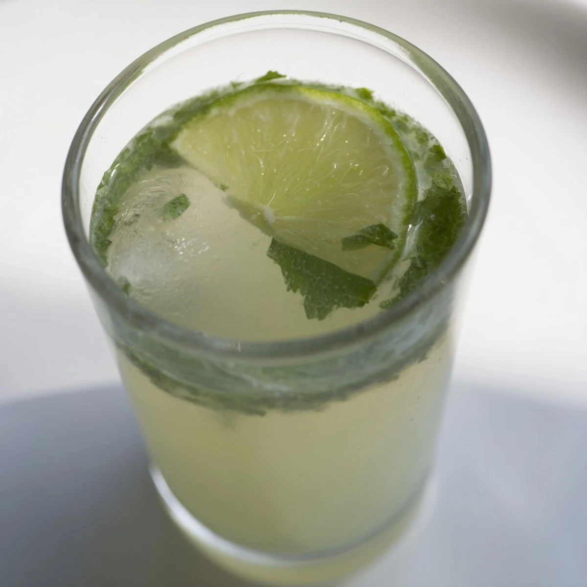 Close-up of a vibrant, homemade Mint Lime Agua Fresca, perfect for any occasion.