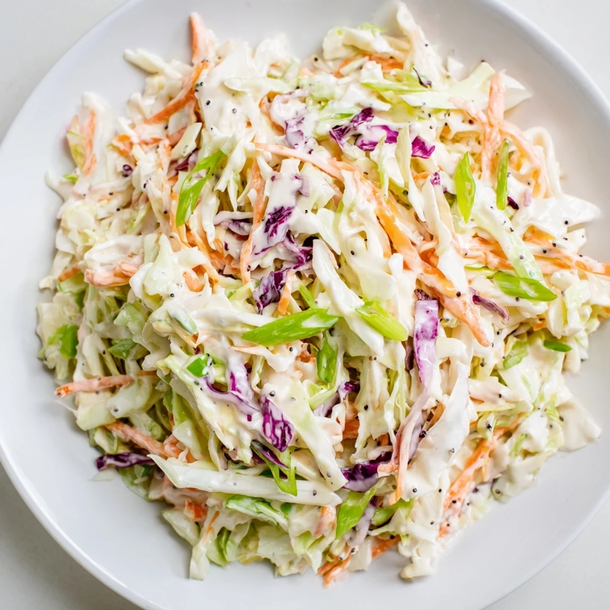 A bowl of delicious Quick Coleslaw Salad with vibrant veggies, perfect as a side dish for any meal.