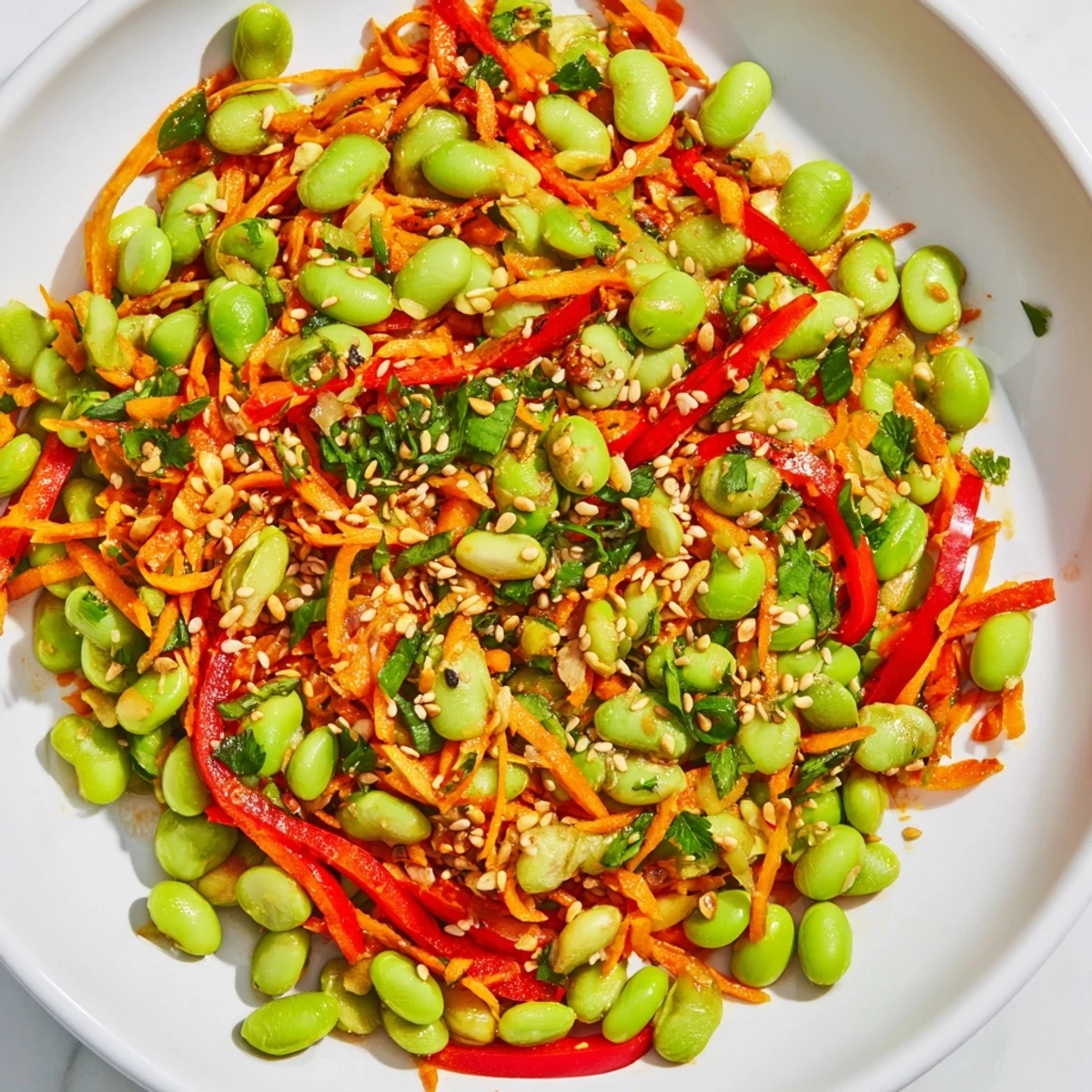 Vibrant Asian Edamame Salad with bright green edamame and a flavorful ginger sesame dressing, ready to eat.