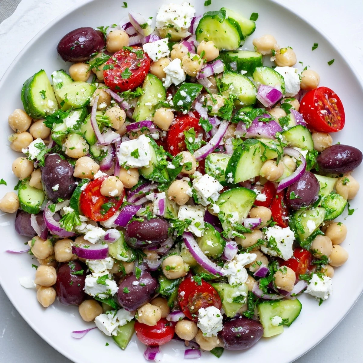 A delicious bowl of Mediterranean chickpea salad, a healthy and flavorful vegetarian dish option.