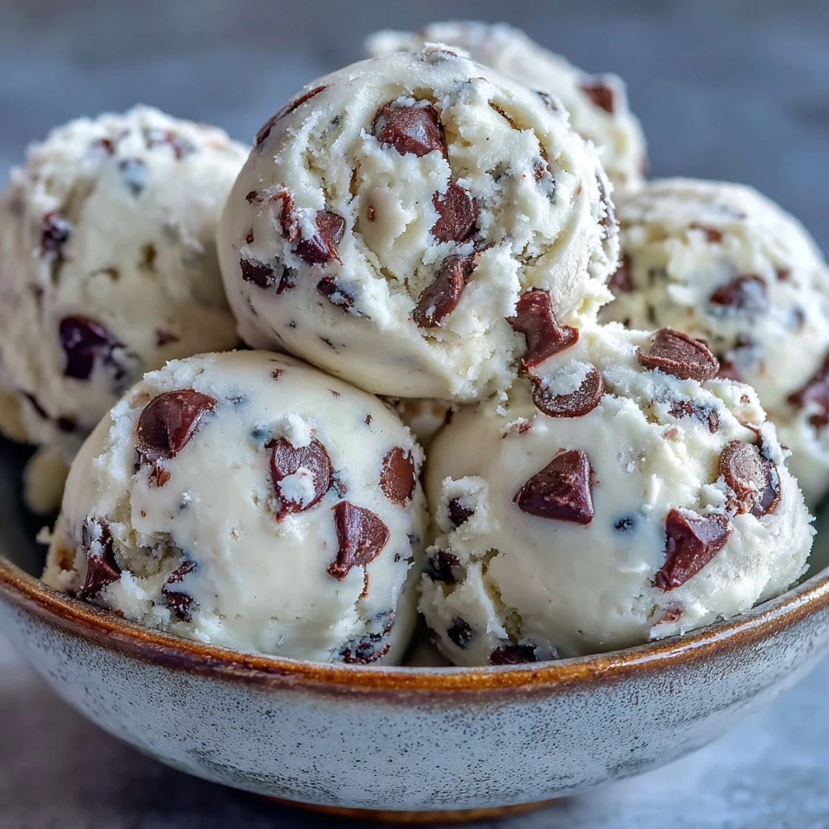 Scoopable Greek Yogurt Cookie Dough with melty chocolate chips and creamy buttery texture served chilled.