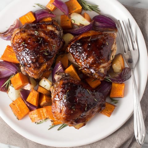 Savory Honey-Glazed Chicken recipe alongside sweet roasted carrots, parsnips, and sweet potatoes.