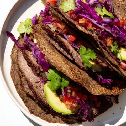 Juicy Coffee-Rubbed Steak Tacos filling warm tortillas, brightened by colorful salsa and avocado slices.