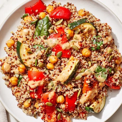 This visually appealing quinoa power protein salad boasts chickpeas and a creamy tahini dressing over grains.