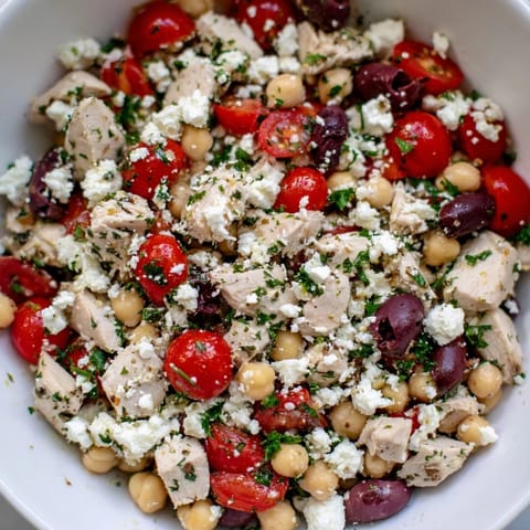 Colorful Mediterranean Chickpea Chicken Salad with creamy feta, olives, and lemon dressing, served as a light lunch.