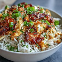 Crispy chili crisp egg fried rice with fluffy scrambled eggs and fresh scallions.  